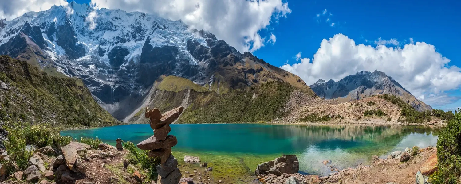 Humantay Lake with turquoise waters surrounded by snow-capped mountains in Cusco.