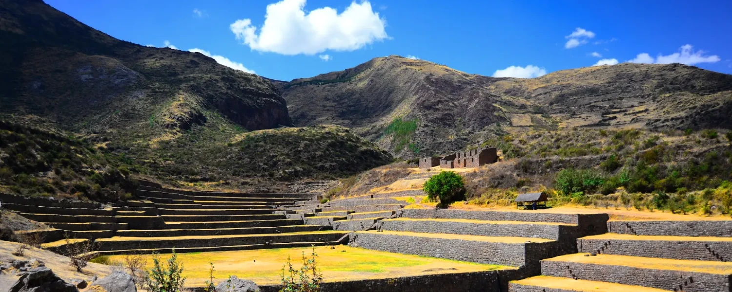 Tipon archaeological complex highlighting ancient flowing water channels and green terraces.