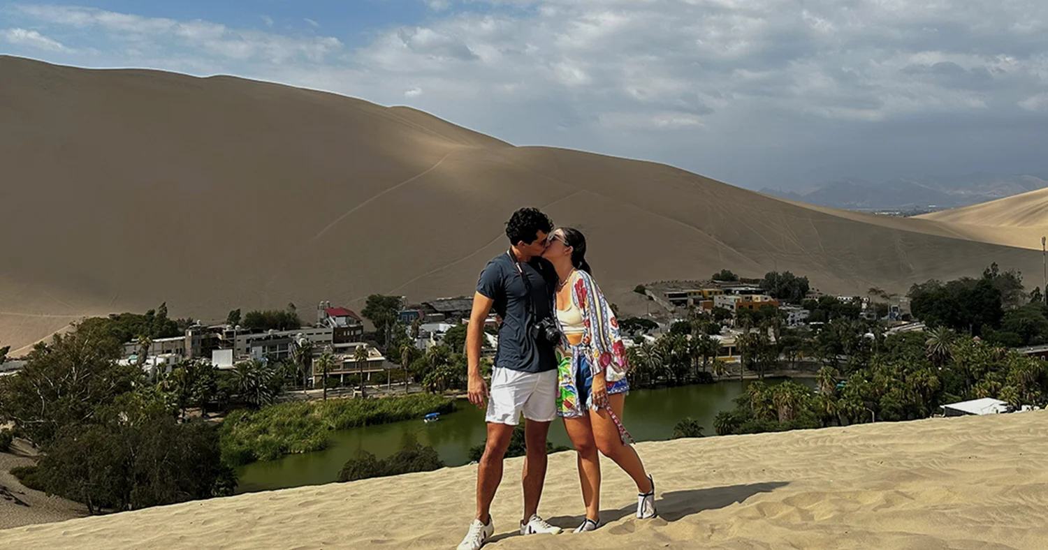 Couple overlooking Huacachina Oasis in Peru
