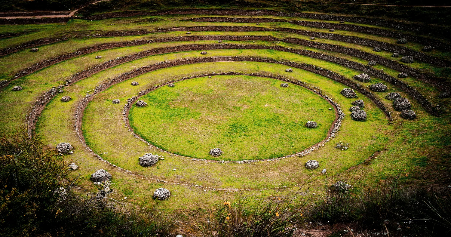 Close view of concentric stone terraces forming a circular agricultural structure at Moray in Cusco