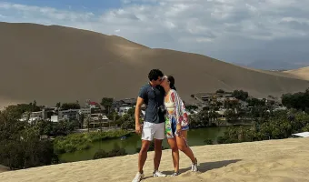 Couple overlooking Huacachina Oasis in Peru