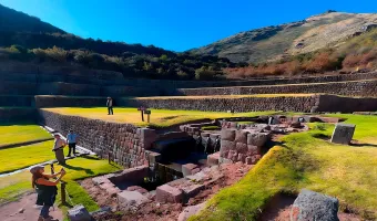 Inca agricultural terraces and stone water channels at Tipon archaeological site in Cusco, Peru